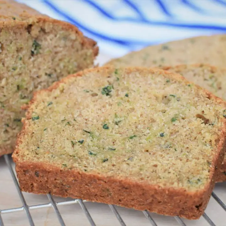 sliced zucchini bread loaf on cooling rack